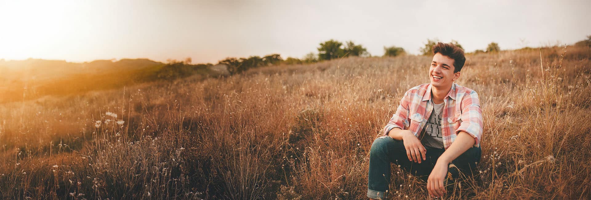 header image of a sitting and thinking out in a field